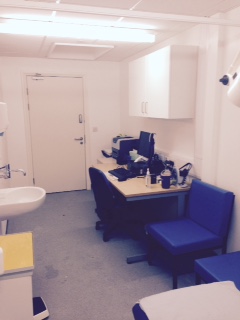 completed room. Showing clinicians desk, chairs to one side