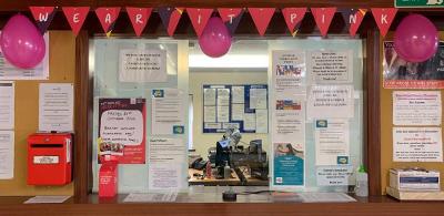 Reception window decorated in pink balloons and bunting